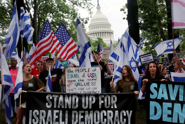  People rally for democracy in Israel before Israeli President Isaac Herzog is scheduled to address congress at the US Capitol building in Washington, US, July 19, 2023 (credit: LEAH MILLIS/REUTERS)