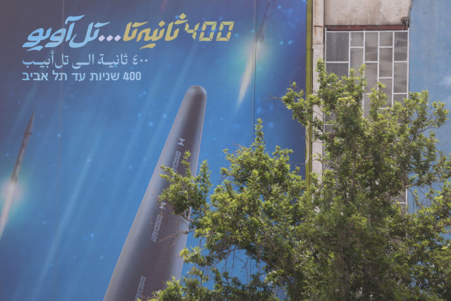  A billboard with a photo of a new hypersonic ballistic missile called ''Fattah'' and with text reading ''400 seconds to Tel Aviv'' is seen on a building in Tehran, Iran June 8, 2023 (credit: MAJID ASGARIPOUR/WANA (WEST ASIA NEWS AGENCY) VIA REUTERS)