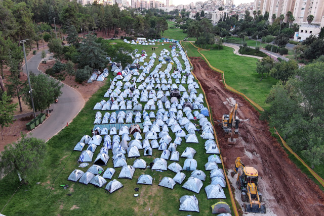  Protesters against the Israeli government's judicial overhaul plans gather in a camp they erected in Jerusalem July 23, 2023. (credit: REUTERS/ILAN ROSENBERG)