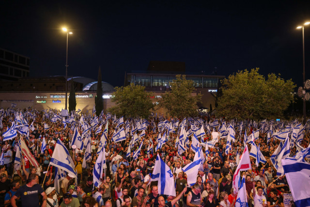  Anti-overhaul activists seen near the Knesset, the Israeli parliament in Jerusalem, during a protest against the government's judicial overhaul, on July 23, 2023. (credit: Chaim Goldberg/Flash90)