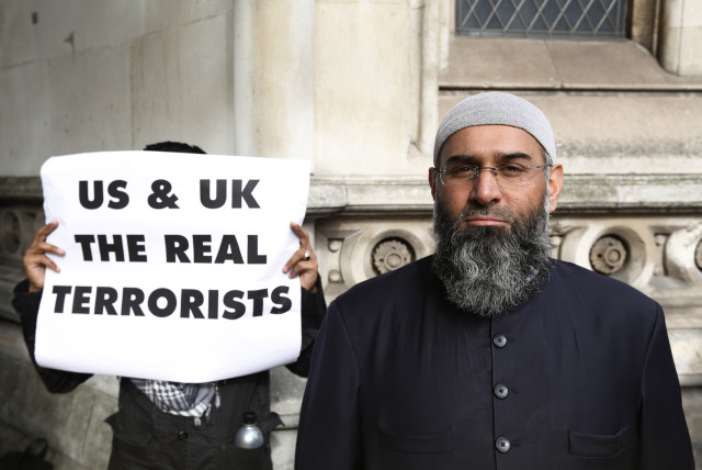  Demonstrator Anjem Choudary, protests in support of Islamist cleric Abu Hamza al-Masri, who is appealing against his extradition to the US, outside the High Court in London October 5, 2012. (credit: REUTERS/LUKE MACGREGOR)
