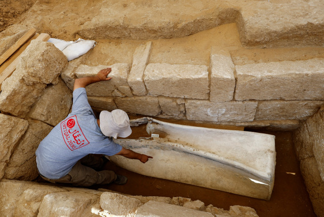  Fadel Al-A'utul, an expert from the French School of Biblical and Archeological Research, works in a Roman-era cemetery in Gaza, July 23, 2023. (credit: REUTERS/MOHAMMED SALEM)