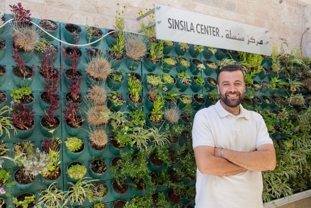 TARIQ NASSAR, creator of the Muslala Sinsila Center, on the roof decked out with wooden planters. (credit: MARC ISRAEL SELLEM)