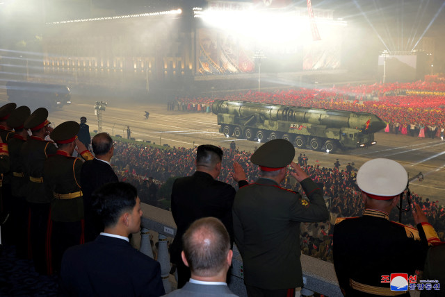  North Korean leader Kim Jong Un, Chinese Communist Party politburo member Li Hongzhong and Russia's Defense Minister Sergei Shoigu observe a display of missiles during a military parade to commemorate the 70th anniversary of the Korean War armistice in Pyongyang, North Korea, July 27, 2023. (credit: KCNA VIA REUTERS)