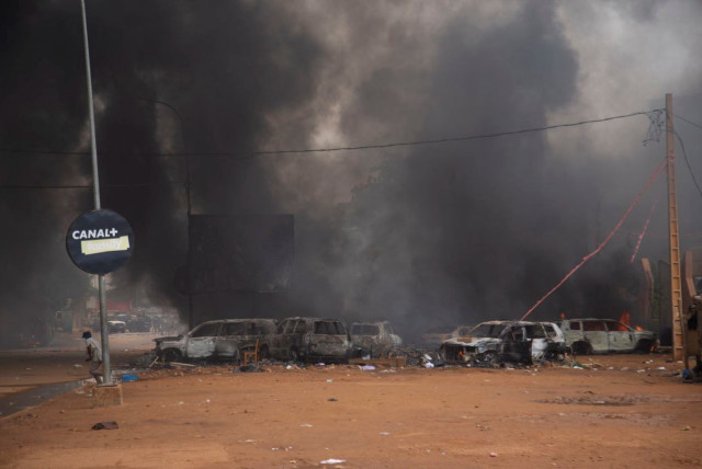  Supporters of the coup set fire to ruling party HQ while hundreds of them gather in front of the National Assembly in the capital Niamey, Niger July 27, 2023. (credit:  REUTERS/Souleymane Ag Anara)