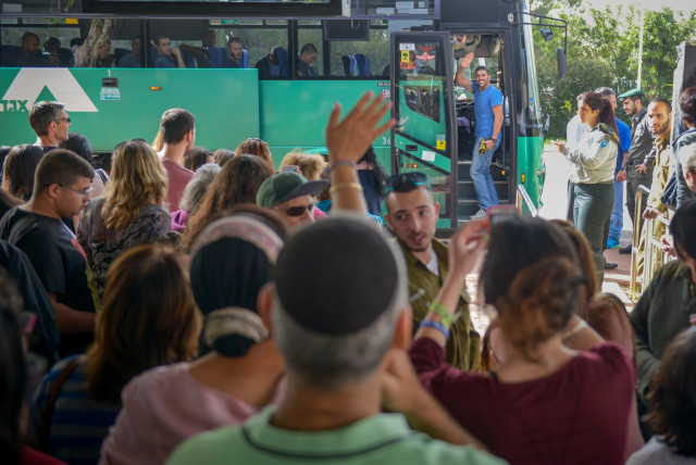 New soldiers saying goodbye to their families on recruitment day. (credit: IDF SPOKESPERSON'S OFFICE)