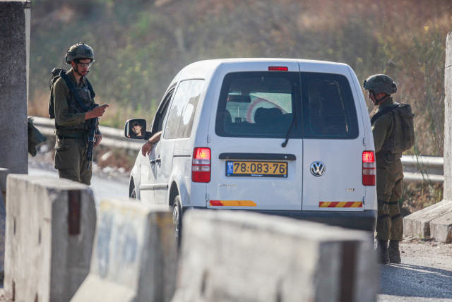  Israeli soldiers guard at a checkpoint not far from the scene of a shooting attack, in the Northern West Bank, July 6, 2023 (credit: NASSER ISHTAYEH/FLASH90)