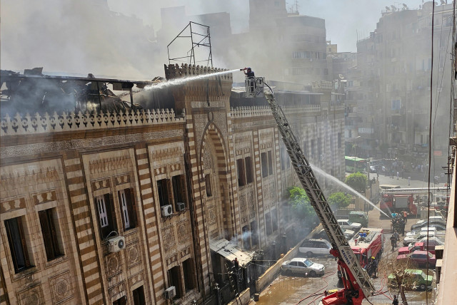  Egyptian firefighters extinguish a fire that broke out in the historic neo-Islamic ministry in central Cairo, Egypt, August 5, 2023. (credit: REUTERS/Patrick Werr)