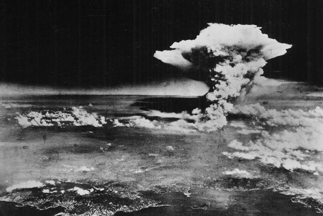  A cloud is seen over Hiroshima made by the firestorm formed following the dropping of the Little Boy atomic bomb on the Japanese city in what is the first use of nuclear weapons in war, on August 6, 1945. (credit: Wikimedia Commons)