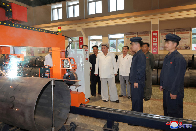 North Korean leader Kim Jong Un gives field guidance at a major weapon factory in this image released by North Korea's Korean Central News Agency on August 6, 2023. (credit: KNCA/REUTERS)