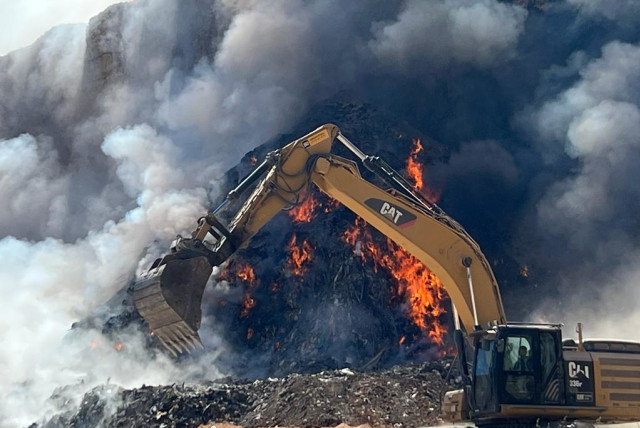  Fire at illegal trash dumping ground caused dangerous air pollution level in Binyamin region of the West Bank on August 7, 2023. (credit: TOVAH LAZAROFF)
