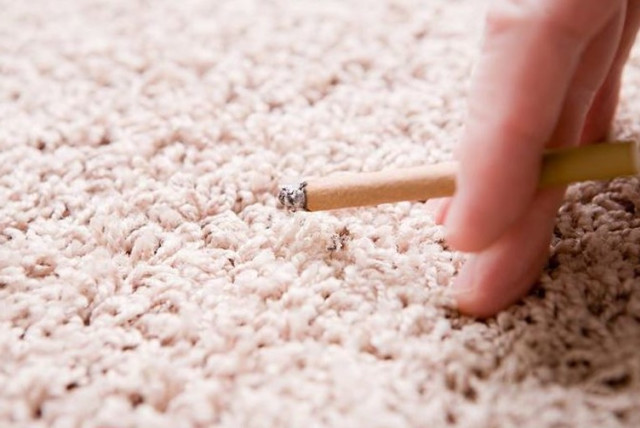 Cigarette next to a carpet (credit: Wikimedia Commons)