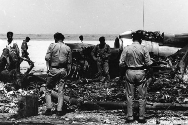  Jordanian soldiers are seen inspecting the wreckage of one of the airplanes destroyed after the hijackings at Dawson's Fields by the PFLP, on September 12, 1970. (credit: Wikimedia Commons)