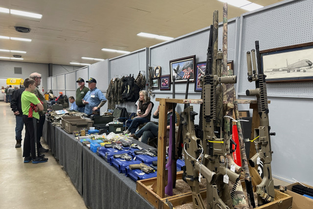  AR-10s for sale at the Belle-Clair Fairgrounds & Expo Center Gun Show, after the state of Illinois passed its ''assault weapons'' ban into law, in Belleville, Illinois, U.S., January 14, 2023. (credit: REUTERS/KATE MUNSCH)