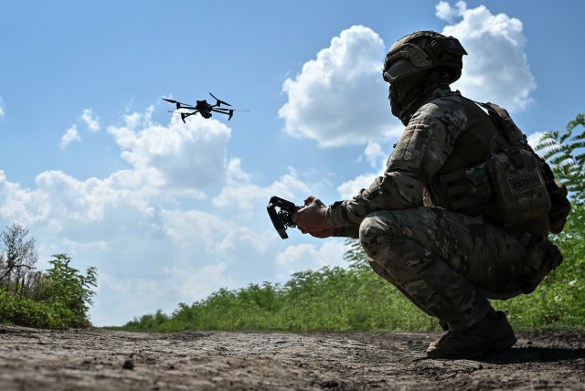   Ukrainian serviceman of 108th separate territorial defence brigade of the Armed Forces of Ukraine launches a drone near a frontline,August 4, 2023 (credit: REUTERS/STRINGER)