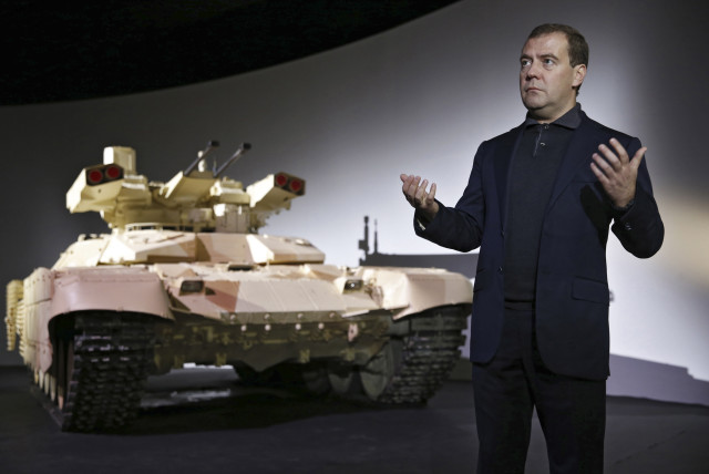  Russia's Dmitry Medvedev speaks during a presentation of the BMPT-72 tank, dubbed the ''Terminator-2'' (credit: REUTERS)
