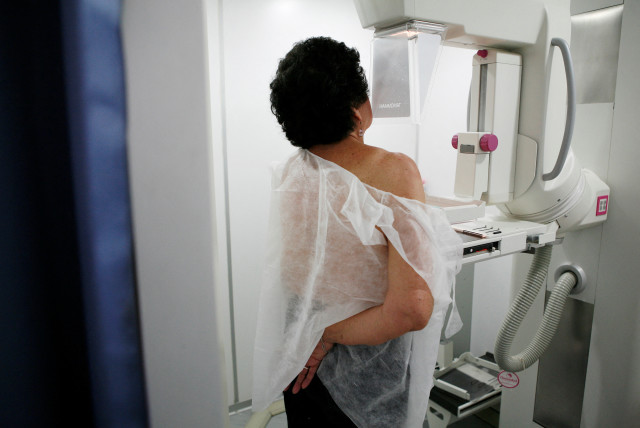  A woman undergoes a free mammogram inside Peru's first mobile unit for breast cancer detection, in Lima (credit: REUTERS/ENRIQUE CASTRO-MENDIVIL)