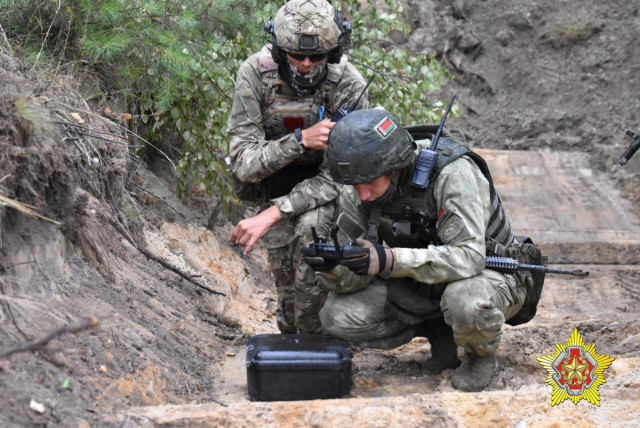  A fighter from Russian Wagner mercenary group and a Belarusian service member take part in a joint training at the Brest military range outside Brest, Belarus, in this still image released July 20, 2023. (credit: Belarusian Defense Ministry/Handout via REUTERS)