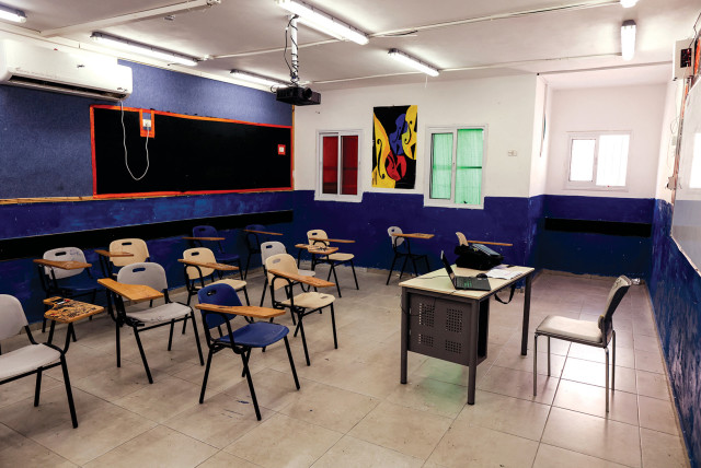  AN EMPTY classroom in an east Jerusalem school, closed in protest at ‘Israeli censorship’ of PA-autorized school textbooks, last year.  (credit: AMMAR AWAD/REUTERS)