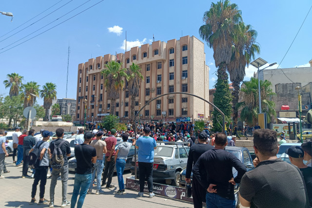 Demonstrators protest against the Syrian government decision on increasing the prices of fuels in Sweida, Syria, August 17,2023 (credit: Sweida 24/Handout via REUTERS)