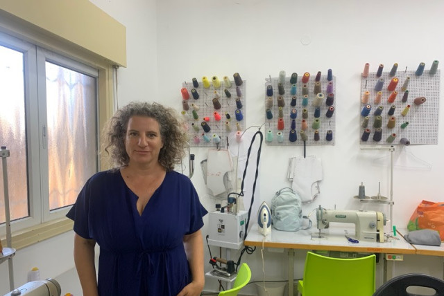  TURNING THE TABLES founder Lilach Tzur Ben Moshe stands for a portrait in the Yotsrot Atid fashion studio in Tel Aviv, last month. (credit: ARIEL SHEINBERG)