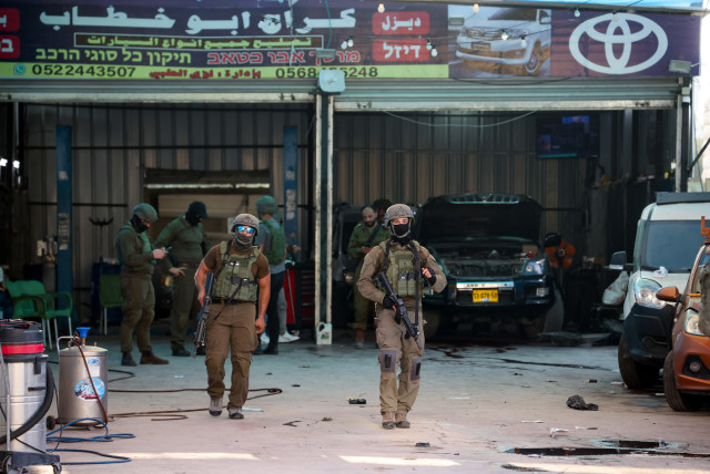  Israeli security forces secure the scene of a shooting attack in Huwara, in the West Bank, near Nablus, August 19, 2023 (photo credit: FLASH90)