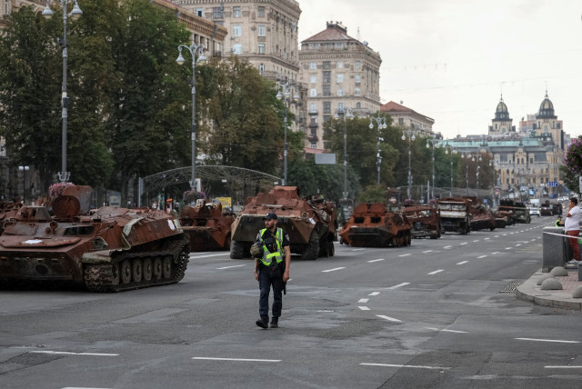 People attend an exhibition displaying destroyed Russian military vehicles located on the main street Khreshchatyk as part of the upcoming celebration of the Independence Day of Ukraine, amid Russia's invasion, in central Kyiv, Ukraine August 21, 2023. (credit: GLEB GARANICH/REUTERS)