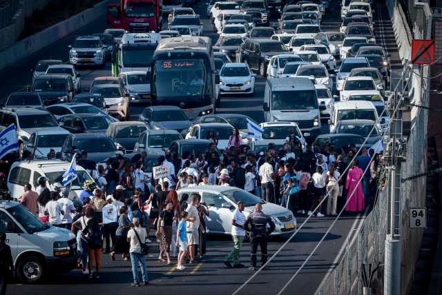  Members of the Jewish Ethiopian community and overs block the Ayalon Highway in Tel Aviv, during a protest demand justice for to 4-year-old Rafael Adana, who was run over and killed in a car accident in Netanya, August 21, 2023. (credit: AVSHALOM SASSONI/FLASH90)
