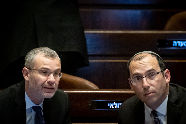  MK Simcha Rothman with Justice Minister Yariv Levin seen during a discussion and a vote in the assembly hall of the Knesset, the Israeli parliament in Jerusalem, on March 22, 2023. (credit: YONATAN SINDEL/FLASH90)