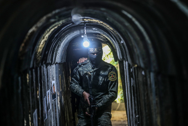  A Palestinian fighter of the Al-Quds brigades, the military wing of Palestinian Islamic Jihad (PIJ), seen inside a military tunnel in Beit Hanun, in the Gaza Strip. May 18, 2022. (photo credit: ATTIA MUHAMMED/FLASH90)