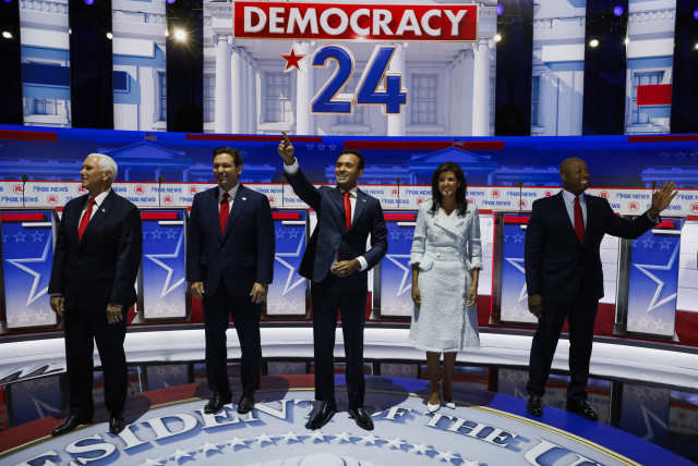 Former U.S. Vice President Mike Pence, Florida Governor Ron DeSantis, businessman Vivek Ramaswamy, former South Carolina Governor Nikki Haley and U.S. Senator Tim Scott (R-SC) pose together before the start before the start of the first Republican candidates' debate of the 2024 U.S. presidential cam (credit: JONATHAN ERNST/REUTERS)