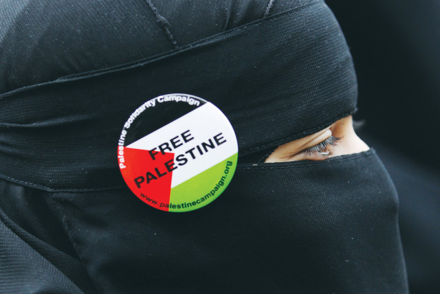  A PROTESTER wears a ‘Free Palestine’ badge during a march to the Israel Embassy in London, in 2010. For over two decades, it’s been clear to those who study antisemitism that its most prevalent current form is anti-Zionism, says the writer.  (credit: Luke MacGregor/Reuters)
