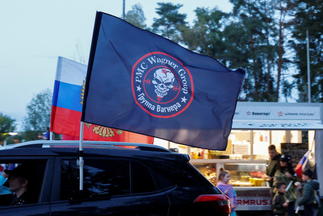  A flag with the logo of Wagner private mercenary group is attached to a car during an automobile rally at a patriotic festival marking Russia's National Flag Day in the Moscow region, Russia, August 23, 2023. (credit: REUTERS/Yulia Morozova)