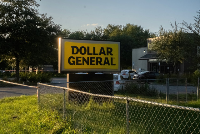  Police investigators continue to work at a Dollar General store a day after a white man armed with a high-powered rifle and a handgun killed three Black people before shooting himself, in what local law enforcement described as a racially motivated crime in Jacksonville, Florida, U.S. August 27, 20 (credit: REUTERS)