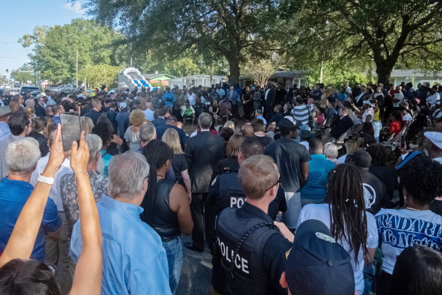   Mourners attend a prayer vigil a day after a white man armed with a high-powered rifle and a handgun killed three Black people at a Dollar General store in Jacksonville, Florida, U.S. August 27, 2023. (credit: REUTERS/Malcolm Jackson)