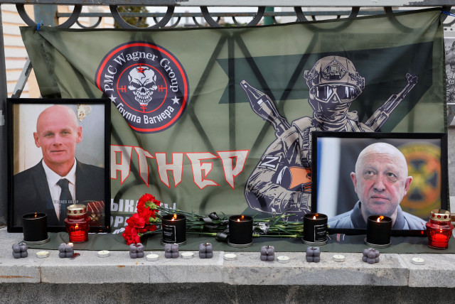  A view shows portraits of Russian mercenary chief Yevgeny Prigozhin and Wagner group commander Dmitry Utkin at a makeshift memorial in Moscow, Russia August 24, 2023. (credit: REUTERS/STRINGER)