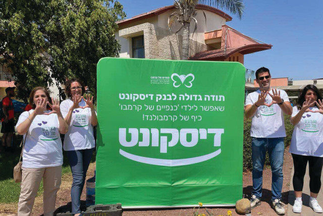  SENIOR ISRAEL DISCOUNT BANK employees at Krembo Wings camp. (credit: Israel Discount Bank )