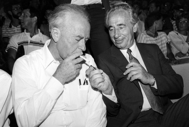  Israeli president Shimon Peres lights the cigarette of late Israeli Prime Minister Yitzhak Rabin (credit: MOSHE SHAI/FLASH90)