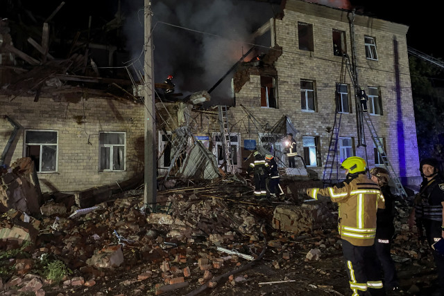  Rescuers work at a site of a building damaged by a Russian drone strike, amid Russia's attack on Ukraine, in Kharkiv, Ukraine August 1, 2023. (credit: REUTERS/Vitalii Hnidyi)