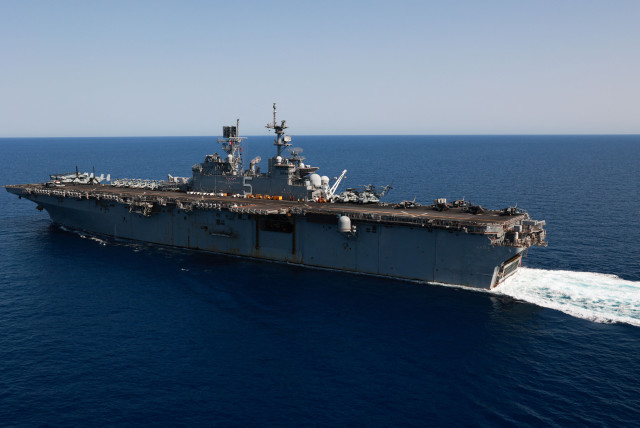  Amphibious assault ship USS Bataan (LHD-5), a component of the Bataan Amphibious Ready Group and 26th Marine Expeditionary Unit, deployed to the U.S. 5th Fleet area of operations to help ensure maritime security and stability in the Middle East region transits the Red Sea. (credit: US NAVAL FORCES CENTRAL COMMAND/US 5TH FLEET/HANDOUT VIA REUTERS)