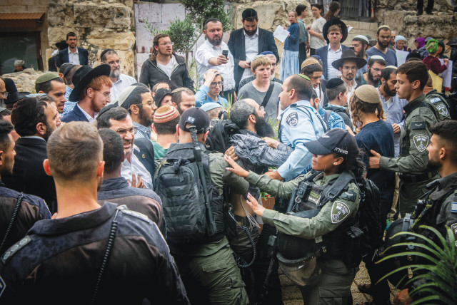  JEWISH ACTIVISTS clash with police during a protest against a Christian conference, outside the Davidson Center in Jerusalem’s Old City, May 28. (credit: Arie Leib Abrams/Flash90)