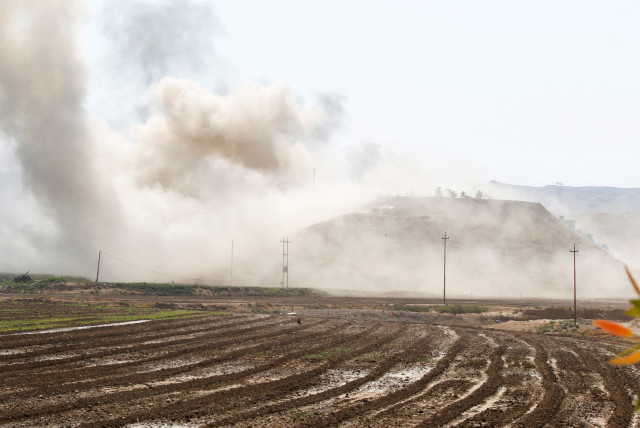  Smoke rises from the Iraqi Kurdistan headquarters of the Kurdistan Freedom Party (PAK), after Iran's Revolutionary Guards' strike on the outskirts of Kirkuk, Iraq September 28, 2022. (credit: AKO RASHEED/REUTERS)