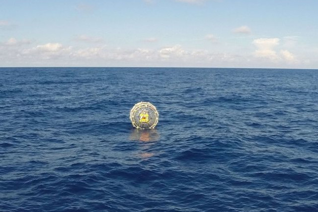  This October 4, 2014 file US Coast Guard handout photo shows the Coast Guard Cutter Bernard C. Webber arriving on scene off the coast of Miami to respond to a report of a man aboard an inflatable hydro bubble who needed assistance. (credit: AFP PHOTO / HANDOUT / US Coast Guard / PO3 Mark Bar)