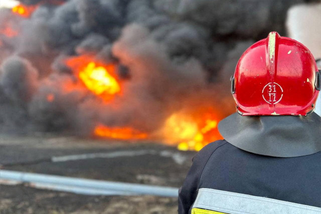  A Ukrainian firefighter works at a site of a Russian drone strike, amid Russia's attack on Ukraine, in Odesa region, Ukraine, in this handout picture released on September 6, 2023 (credit: STATE EMERGENCY SERVICE OF UKRAINE /HANDOUT VIA REUTERS)