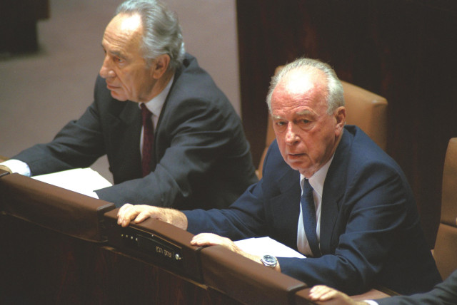  THEN-FOREIGN minister Shimon Peres and prime minister Yitzhak Rabin attend the Knesset debate on the Oslo I agreement on September 21, 1993. (credit: Avi Ohayon/GPO)