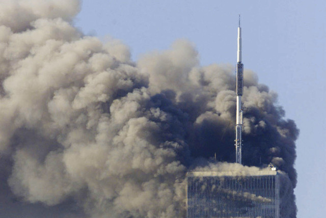  SMOKE BILLOWS from the World Trade Center towers after planes were crashed into them by al-Qaeda terrorists, on September 11, 2001. (photo credit: REUTERS)