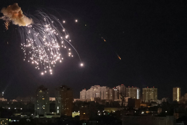 An explosion of a drone is seen in the sky over the city during a Russian drone strike, amid Russia's attack on Ukraine, in Kyiv, Ukraine September 10, 2023. (credit: GLEB GARANICH/REUTERS)