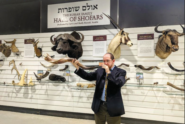  RABBI DR. NATAN SLIFKIN blows one of his shofars at the Biblical Museum of Natural History in Beit Shemesh.  (photo credit: Biblical Museum of Natural History)