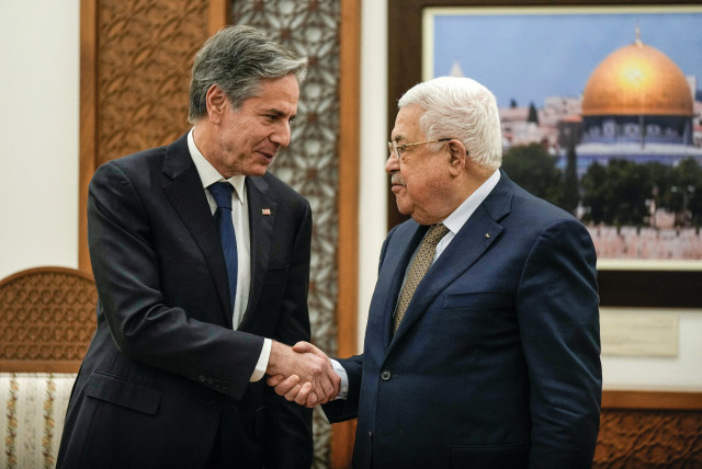  US Secretary of State Antony Blinken shakes hands with Palestinian Authority head Mahmoud Abbas in Ramallah, earlier this year. The Biden administration should stop paying the PA’s bills, says the writer.  (credit: MAJDI MOHAMMED/REUTERS)