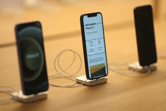  iPhone 12s are seen at the new Apple Store on Broadway in downtown Los Angeles, California, US, June 24, 2021 (credit: REUTERS/LUCY NICHOLSON)